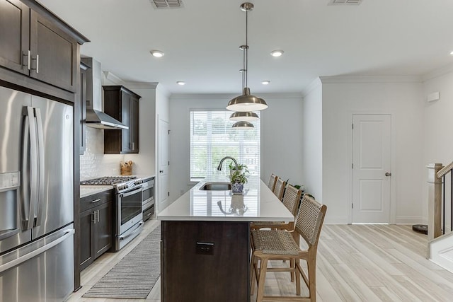 1117 Larkin Dr, Buford, GA 30518 - kitchen featuring appliances with stainless steel finishes, wall chimney range hood, a sink, crown molding, and tasteful backsplash