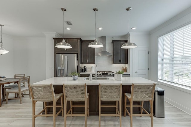 1117 Larkin Dr, Buford, GA 30518 - kitchen with stainless steel fridge with ice dispenser, wall chimney range hood, healthy amount of natural light, a sink, and ornamental molding