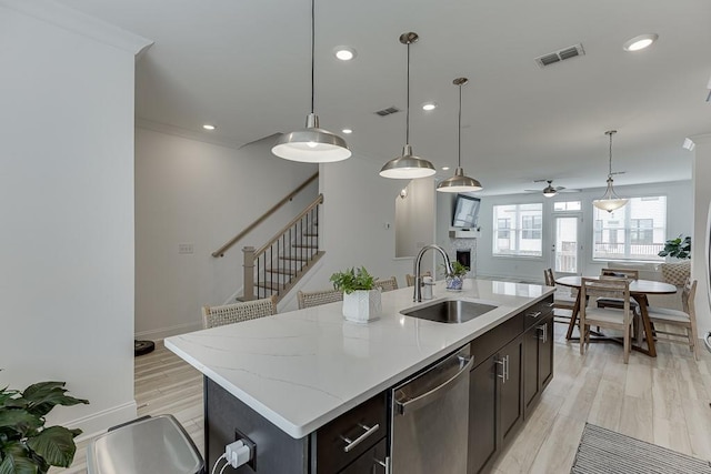 1117 Larkin Dr, Buford, GA 30518 - kitchen featuring dishwasher, a sink, a ceiling fan, light wood-type flooring, and open floor plan