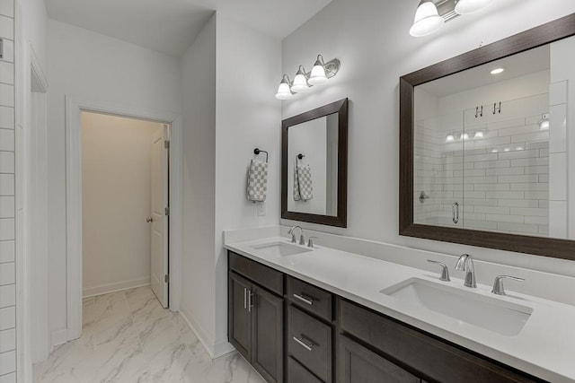 1117 Larkin Dr, Buford, GA 30518 - full bathroom featuring double vanity, marble finish flooring, a stall shower, and baseboards