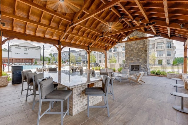 1117 Larkin Dr, Buford, GA 30518 - view of patio with an outdoor stone fireplace
