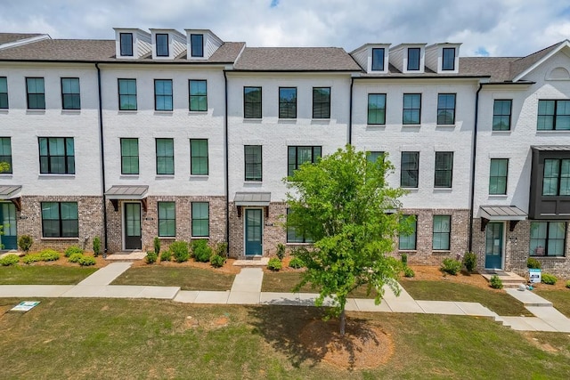 1117 Larkin Dr, Buford, GA 30518 - townhome / multi-family property with a front yard