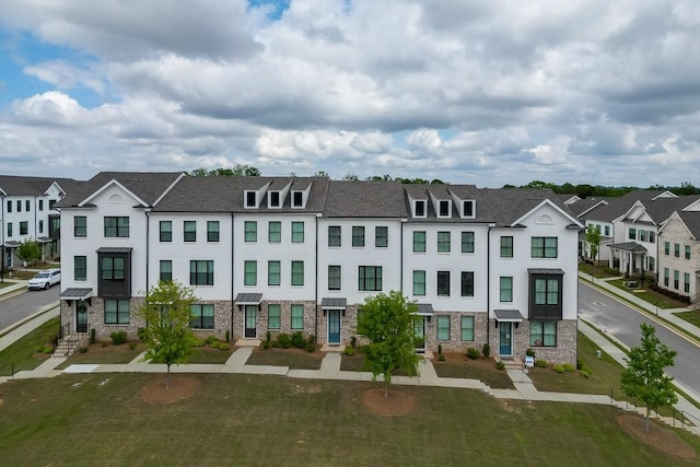 1117 Larkin Dr, Buford, GA 30518 - townhome / multi-family property with stucco siding, a residential view, and stone siding