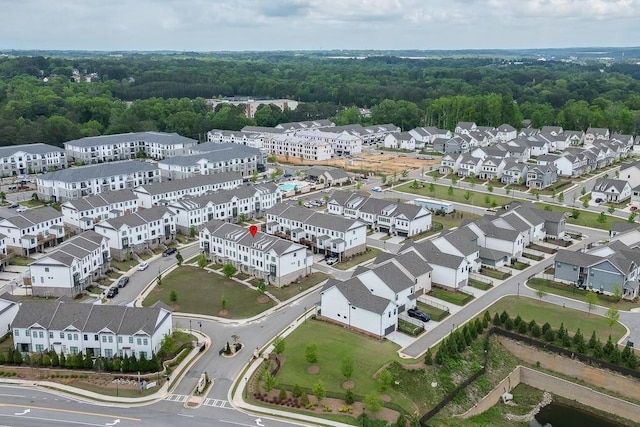 1117 Larkin Dr, Buford, GA 30518 - aerial perspective of suburban area featuring a forest