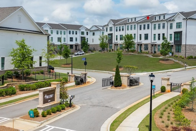 1117 Larkin Dr, Buford, GA 30518 - view of asphalt road with sidewalks, curbs, a residential view, and street lights