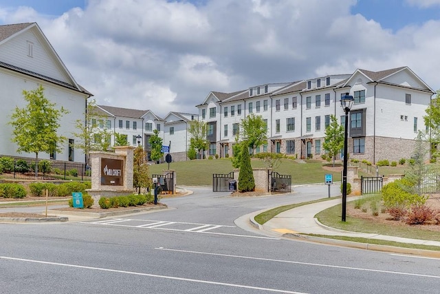 1117 Larkin Dr, Buford, GA 30518 - view of asphalt street featuring sidewalks, curbs, and street lighting