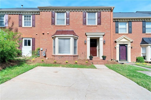 multi unit property featuring brick siding