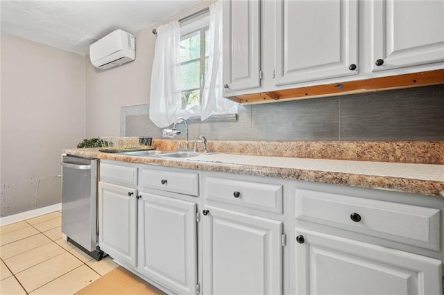210 Estoria St SE, Atlanta, GA 30316 - kitchen with dishwasher, an AC wall unit, white cabinetry, light countertops, and light tile patterned floors