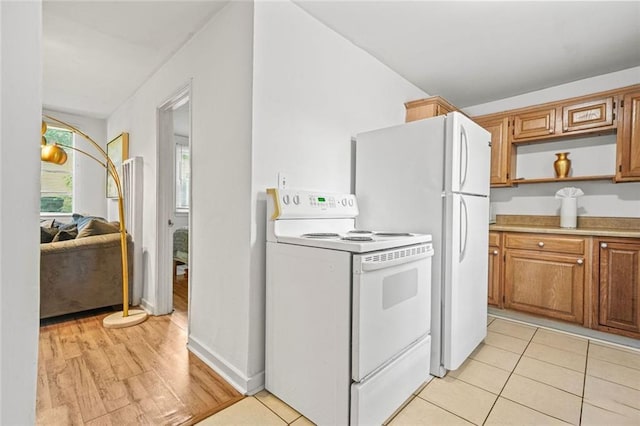 210 Estoria St SE, Atlanta, GA 30316 - kitchen with white electric range, open shelves, light countertops, brown cabinets, and light tile patterned floors