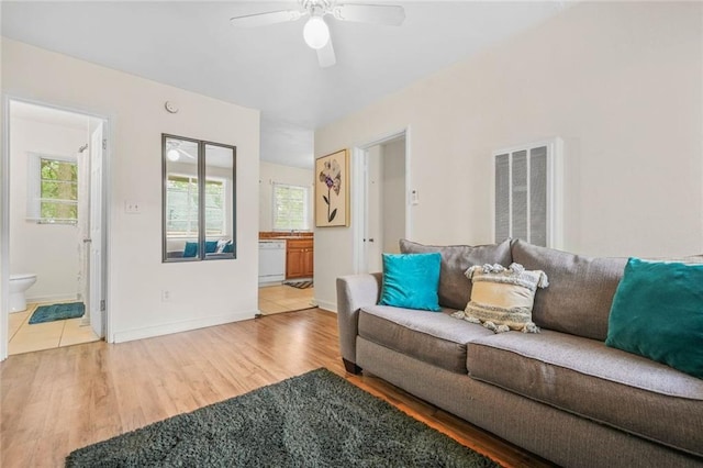 210 Estoria St SE, Atlanta, GA 30316 - living room with healthy amount of natural light, a ceiling fan, wood finished floors, and baseboards