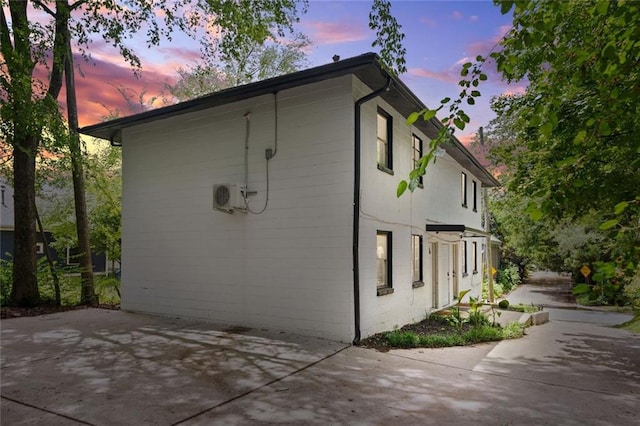 210 Estoria St SE, Atlanta, GA 30316 - property exterior at dusk featuring a patio area and a cooling unit