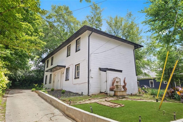 210 Estoria St SE, Atlanta, GA 30316 - view of property exterior with a lawn