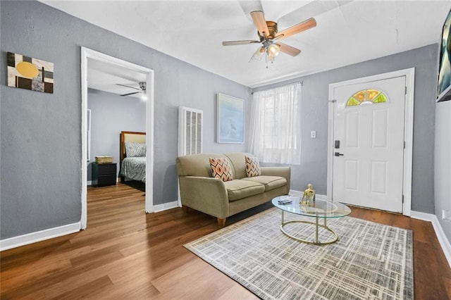 210 Estoria St SE, Atlanta, GA 30316 - living room featuring a ceiling fan, wood finished floors, and baseboards