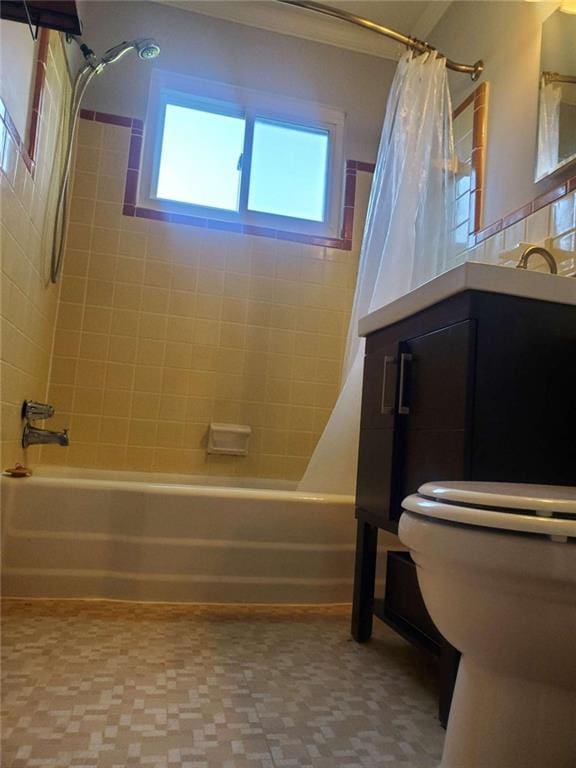 full bathroom featuring shower / bath combination with curtain and toilet