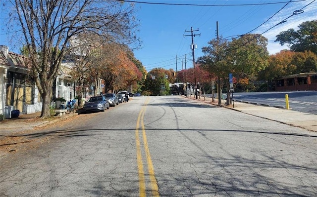 view of road featuring curbs