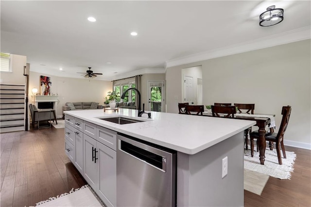 1105 Sterling Brooke Dr, Alpharetta, GA 30022 - kitchen featuring dishwasher, open floor plan, crown molding, dark wood-type flooring, and a kitchen island with sink