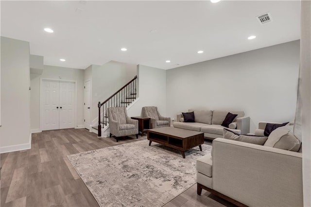 1105 Sterling Brooke Dr, Alpharetta, GA 30022 - living room featuring stairs, wood finished floors, and recessed lighting