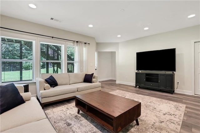 1105 Sterling Brooke Dr, Alpharetta, GA 30022 - living area featuring plenty of natural light, wood finished floors, and recessed lighting