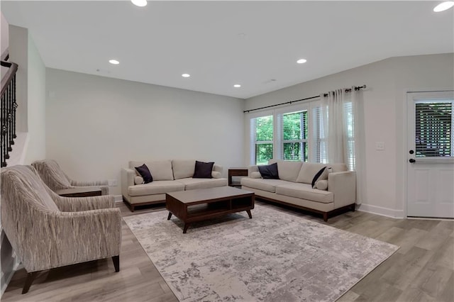 1105 Sterling Brooke Dr, Alpharetta, GA 30022 - living area featuring light wood finished floors, recessed lighting, and stairway