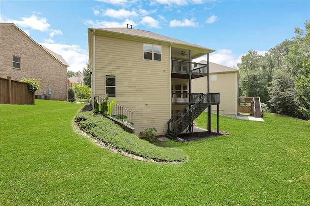 1105 Sterling Brooke Dr, Alpharetta, GA 30022 - back of property featuring stairs, a ceiling fan, a lawn, and a deck