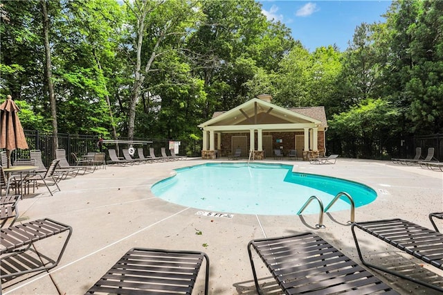 1105 Sterling Brooke Dr, Alpharetta, GA 30022 - community pool featuring view of wooded area and a patio