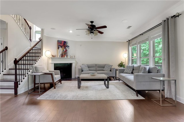 1105 Sterling Brooke Dr, Alpharetta, GA 30022 - living area featuring healthy amount of natural light, a ceiling fan, stairs, wood finished floors, and recessed lighting
