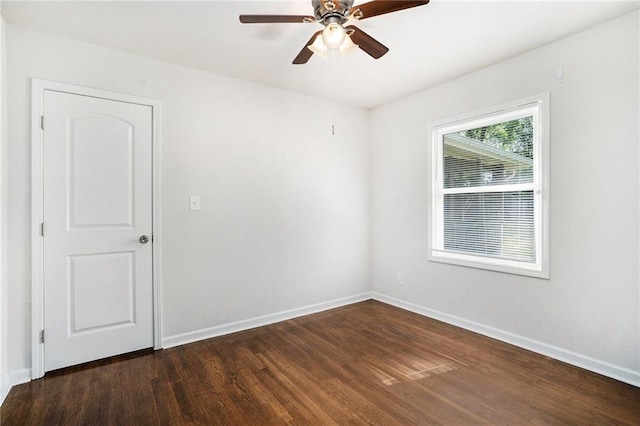 2308 Scotty Cir, Decatur, GA 30032 - empty room with dark wood finished floors, baseboards, and a ceiling fan