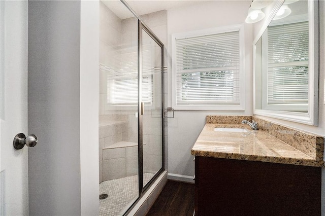 2308 Scotty Cir, Decatur, GA 30032 - full bathroom featuring a stall shower, vanity, baseboards, and wood finished floors