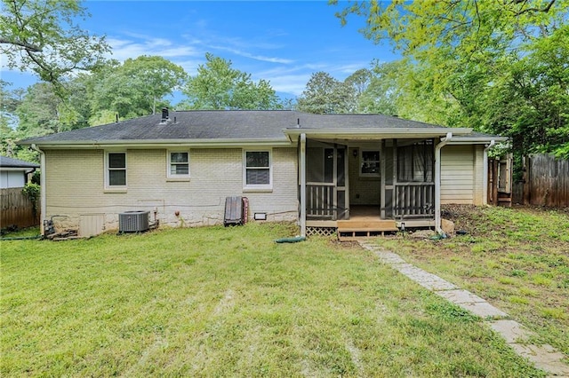 2308 Scotty Cir, Decatur, GA 30032 - rear view of house featuring brick siding, a sunroom, and crawl space