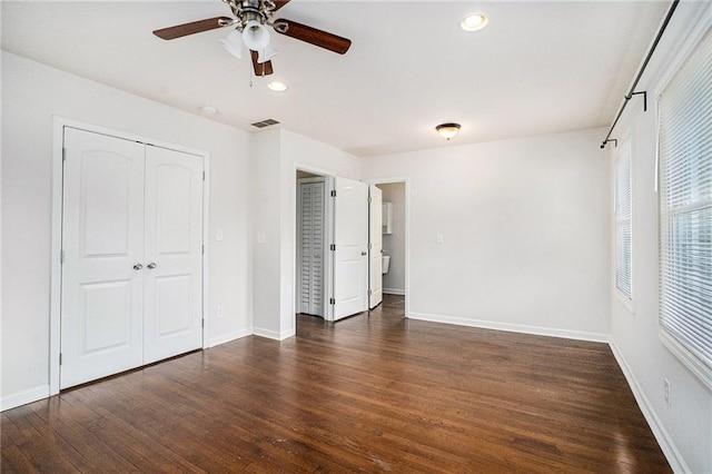 2308 Scotty Cir, Decatur, GA 30032 - unfurnished bedroom with multiple windows, wood finished floors, and recessed lighting