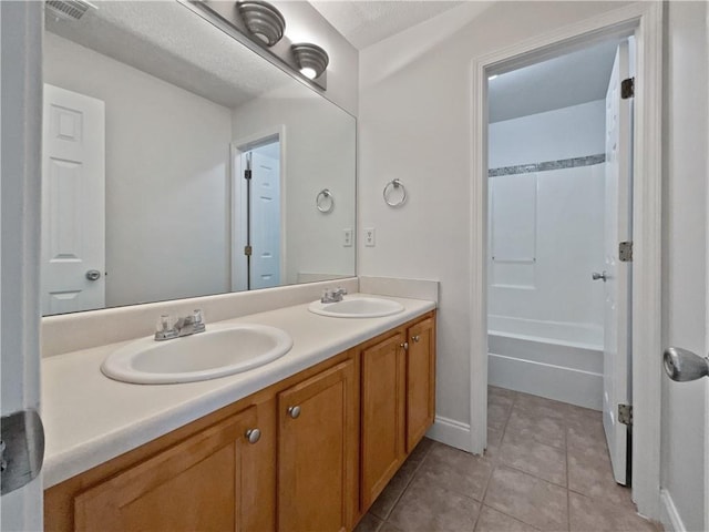 bathroom featuring tile patterned flooring and vanity