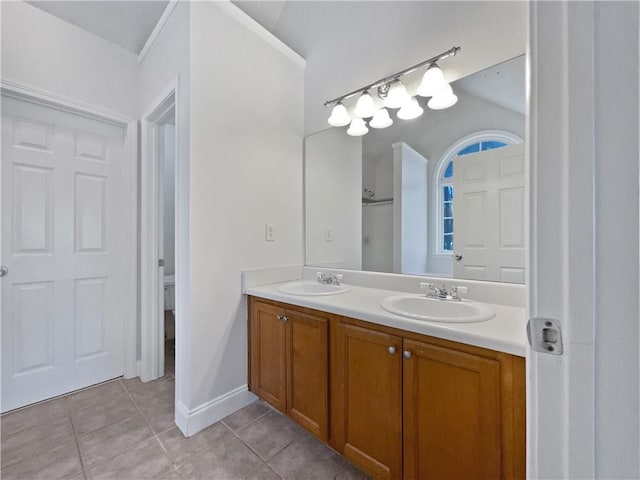 bathroom with vanity, toilet, and tile patterned flooring