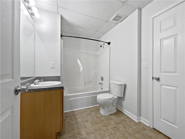 full bathroom featuring a paneled ceiling, vanity, toilet, and shower / bath combination