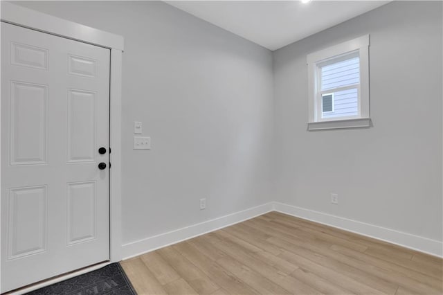 foyer with light hardwood / wood-style floors