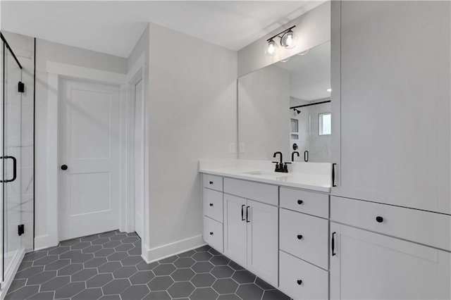 bathroom with vanity, tile patterned floors, and a shower with shower door