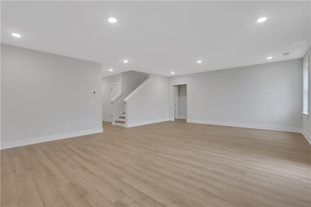 unfurnished living room with light wood-type flooring