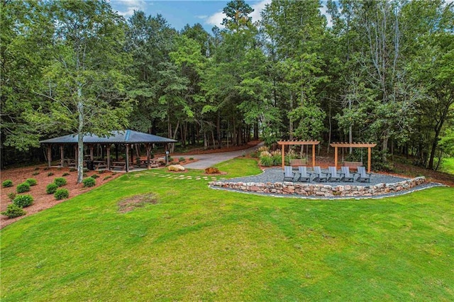 view of yard with a pergola and a gazebo