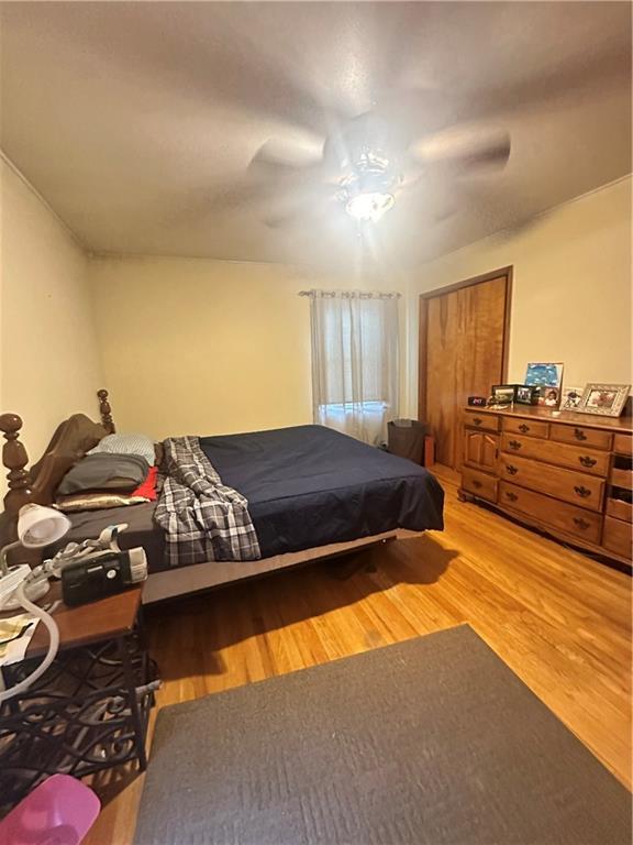 bedroom featuring ceiling fan and hardwood / wood-style flooring