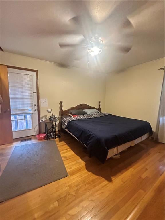 bedroom featuring hardwood / wood-style floors and ceiling fan