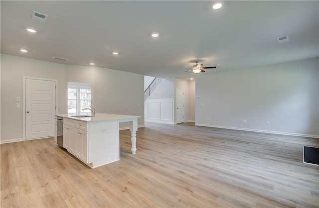 0 Cooper Cv E, Fayetteville, GA 30215 - kitchen with ceiling fan, a center island with sink, white cabinets, a sink, and open floor plan