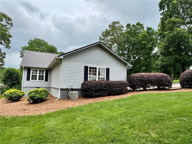270 Owens Cir NE, Calhoun, GA 30701 - view of side of home featuring a lawn, metal roof, crawl space, and central AC