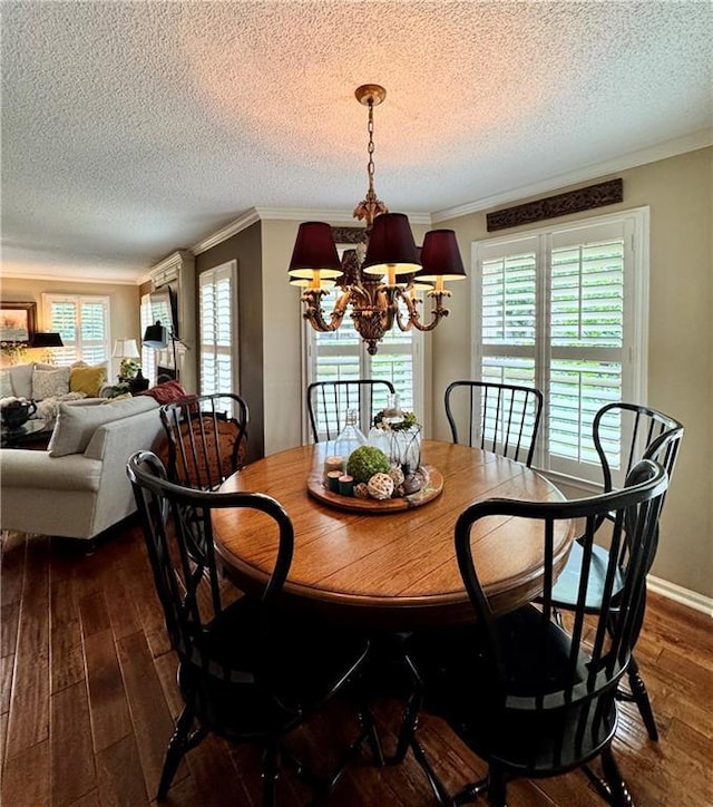 270 Owens Cir NE, Calhoun, GA 30701 - dining room with a chandelier, dark wood-type flooring, plenty of natural light, ornamental molding, and a textured ceiling