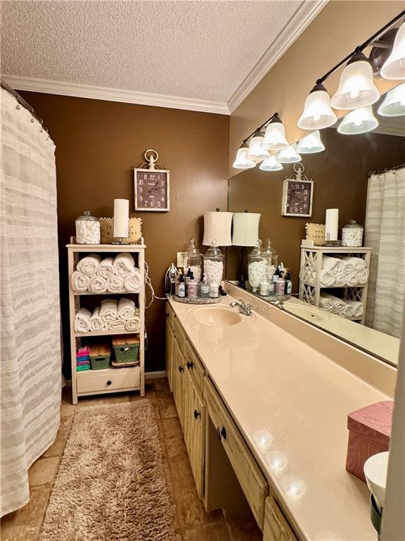 270 Owens Cir NE, Calhoun, GA 30701 - full bathroom with a textured ceiling, ornamental molding, and vanity