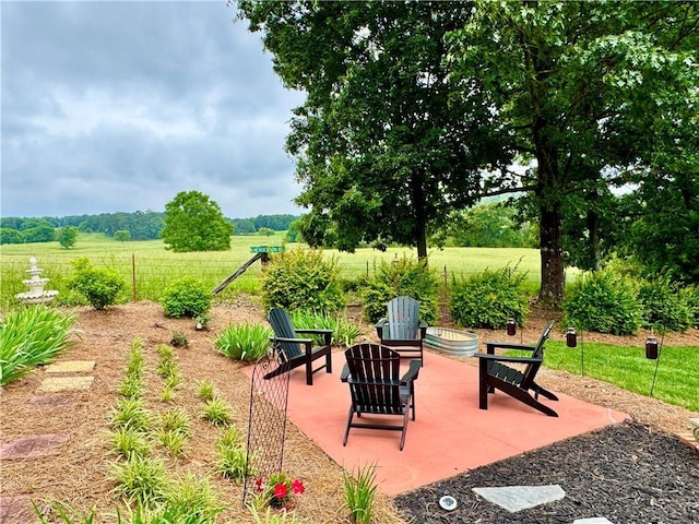 270 Owens Cir NE, Calhoun, GA 30701 - view of patio / terrace with fence, a fire pit, and a view of rural / pastoral area