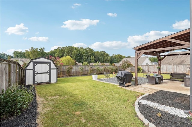 view of yard with a gazebo, a patio, and a storage unit