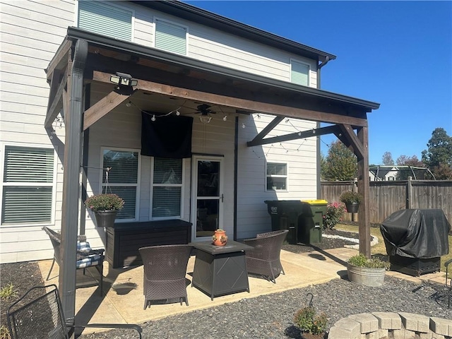 view of patio with area for grilling and ceiling fan