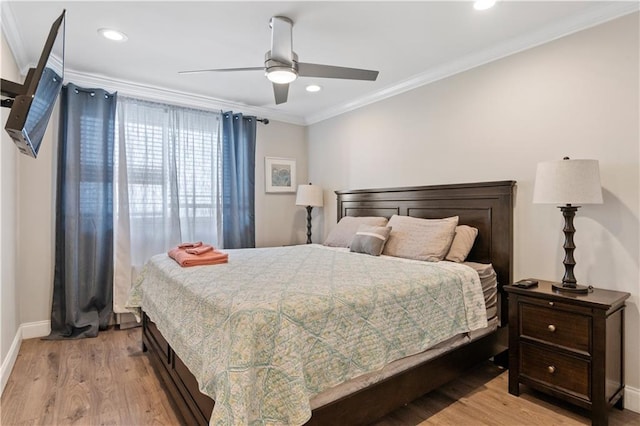 bedroom with ceiling fan, light hardwood / wood-style flooring, and ornamental molding