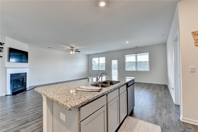 82 Graham Campbell Ln, Statham, GA 30666 - kitchen featuring open floor plan, a sink, a ceiling fan, light stone counters, and recessed lighting