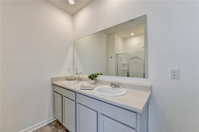 82 Graham Campbell Ln, Statham, GA 30666 - bathroom featuring double vanity, a shower stall, and baseboards