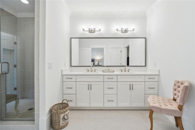 bathroom with ornamental molding, walk in shower, tile patterned floors, and vanity